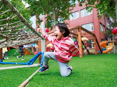 Man playing with children staying energetic