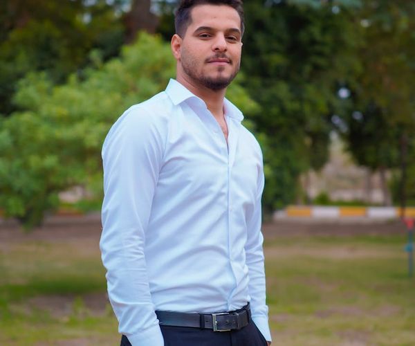 Man standing confidently with good posture outdoors