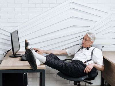 Man working at a computer desk needing a movement break